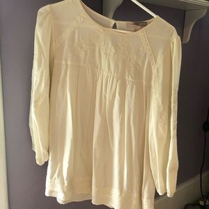Cream colored blouse with embroidery detailing